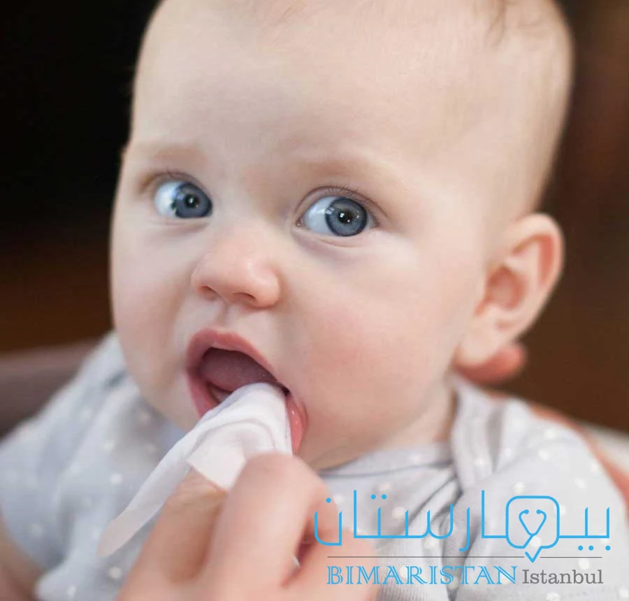 Clean the child's mouth with a cloth